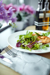grilled chicken breast and salad
