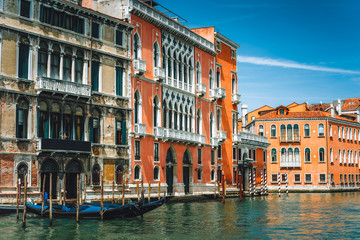Old ancient facades of houses on Grand Canal, Venice, Italy. Vintage hotels and residential buildings in the Venice center. Historical architecture of Venice on water in summer