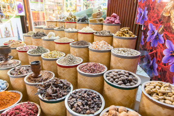 Dubai, United Arab Emirates – November 15, 2019: Covered alley of a traditional bazaar with shops in the Deira district.