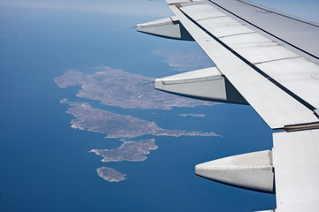 Fototapeta premium Panoramic view of the Greek islands, Cyclades from the window of an airliner.