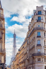 Fototapeta na wymiar A street with Hausmanian Building, leading to the Eiffel Tower, center Paris, France.