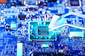 Quantum processor. Technician plug in CPU microprocessor to motherboard socket. Computer repair.