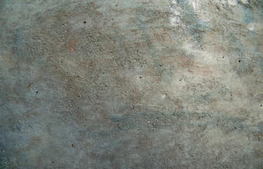 Abstract background. An old concrete wall with patches of various shades of gray and light blue. Structure, background.
