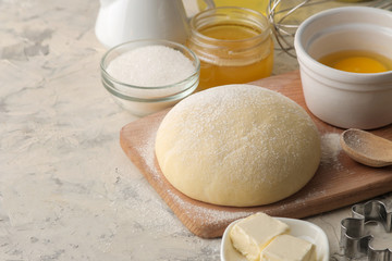 Dough for baking. making delicious cookies. Ingredients for the dough, eggs, flour, butter, sugar on a light background.