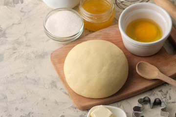 Dough for baking. making delicious cookies. Ingredients for the dough, eggs, flour, butter, sugar on a light background.