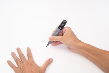 Man hand holding black magic marker pen writing on white background
