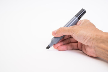 Man hand holding black magic marker pen writing on white background