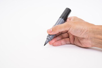 Man hand holding black magic marker pen writing on white background