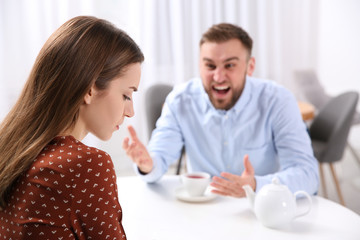 Obraz na płótnie Canvas Couple having quarrel in cafe. Relationship problems