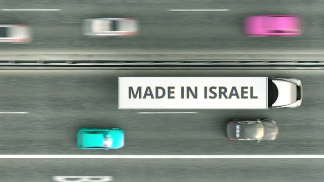 Aerial top down view of semi-trailer trucks with MADE IN ISRAEL text driving along the road. Israeli business related loopable 3D animation