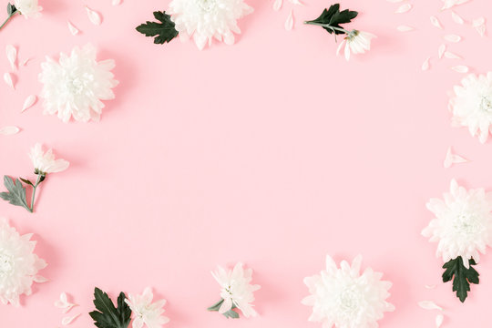 Beautiful flowers composition. Border made of white flowers on pastel pink background. Valentines Day, Easter, Happy Women's Day, Mother's day. Flat lay, top view, copy space 