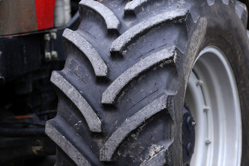 huge wheels of a new large tractor for agriculture