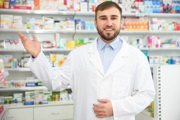 Portrait of professional pharmacist in modern drugstore