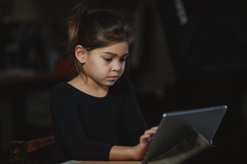 girl playing on a tablet