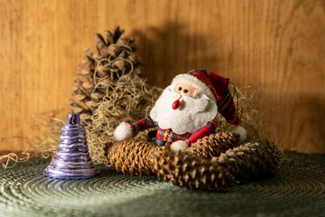 Christmas motifs featuring a Santa Claus surrounded by decorative ornaments for Christmas Day