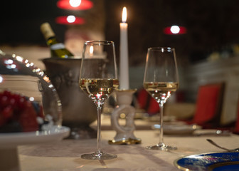 setting the table with wine for two in the evening in the restaurant