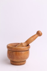 cooking wooden mortar in color background