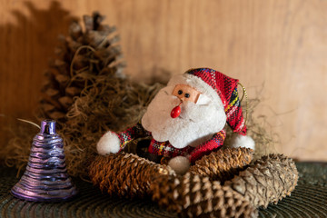 Christmas motifs featuring a Santa Claus surrounded by decorative ornaments for Christmas Day