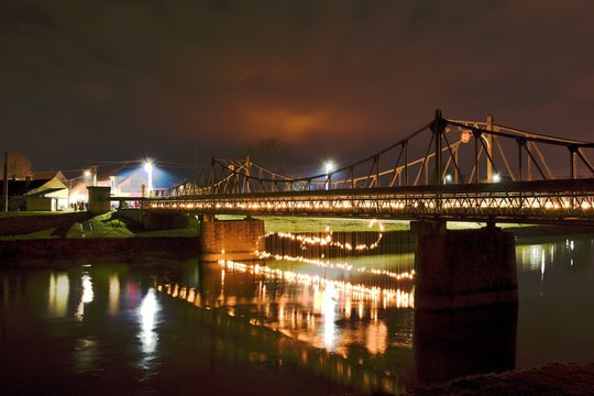 Historic iron bridge at night