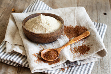 Teff flour in a bowl and teff grain with a spoon