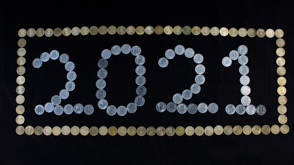 Coin art depicting the year two thousand  and twenty one,  2021