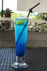 Blue ice land mocktail in tall glass with straw