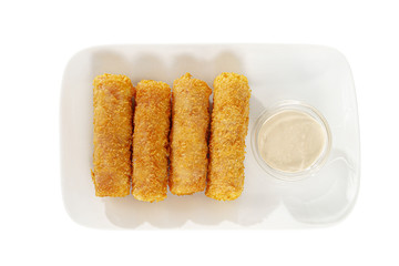 Hot appetizer Cheese sticks in crispy golden breaded, fried in oil, mayonnaise sauce, tar-tar, before alcohol on plate, white isolated background view from above. For the menu, restaurant, bar, cafe