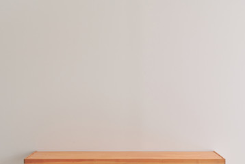 White wall background, wooden table and vase of flower style.