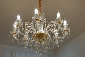 Luxury chandelier on the ceiling of a luxury restaurant.
