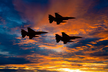Silhouette army Show performant of air craft in air show with sun sky ocean view at sunset time...