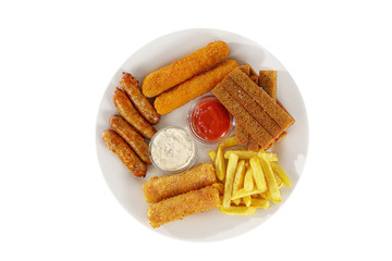 Hot appetizer croutons from rye bread, set of chicken nuggets, sausages, cheese sticks in breading, French fries, mayonnaise sauce, tar-tar, ketchup on plate, white isolated background view from above