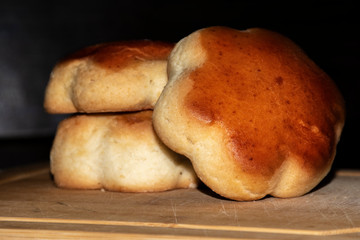 Homemade bread, bread on a wooden board, place for text.