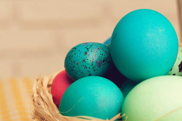 Easter decorative nest with colored eggs close up