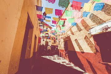 Fototapeta premium Colored colonial houses in old town of Guanajuato. Colorful alleys and narrow streets in Guanajuato city, Mexico. Spanish Colonial Style.