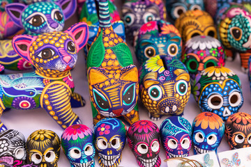 Decorated colorful skulls, ceramics death symbol at market, day of dead, Mexico.