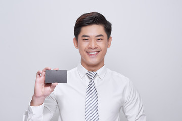 Handsome man in white shirt with black card