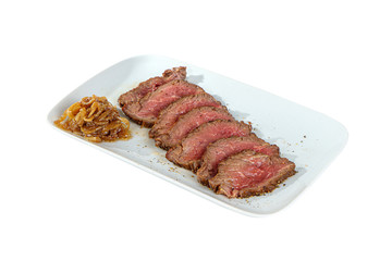 Cold appetizer before alcohol, food, marinated roast beef, fried, beef, with pickled onions, slices, 7 pieces on square plate, white isolated background Side view. For the menu, restaurant, bar cafe