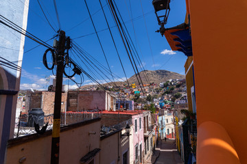 Colored colonial houses in old town of Guanajuato. Colorful alleys and narrow streets in Guanajuato city, Mexico. Spanish Colonial Style. © Curioso.Photography