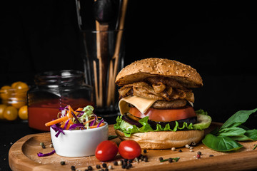 Vegetarian burger made of squash and tomato grilled courgette black background