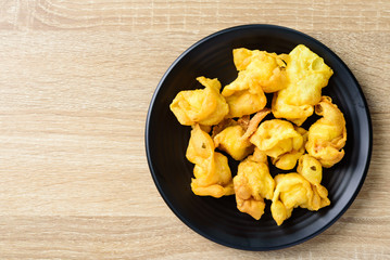 Deep-fried crispy wonton stuffed with minced pork, quail egg and shrimp. Asian food	
