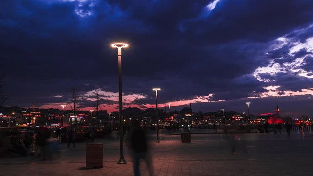 Day to night time lapse with people movements from city square in Istanbul 