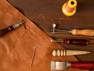 Genuine Leather. Sewing a purse. Leather work. Tools for sewing bags, wallets, clutches. Stitching....