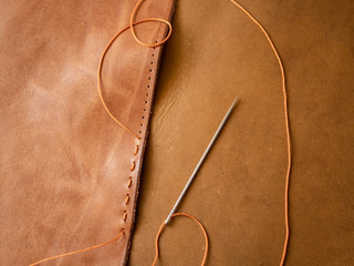 Genuine Leather. Sewing a purse. Leather work. Tools for sewing bags, wallets, clutches. Stitching....