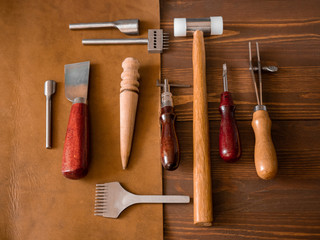Genuine Leather. Sewing a purse. Leather work. Tools for sewing bags, wallets, clutches. Stitching....