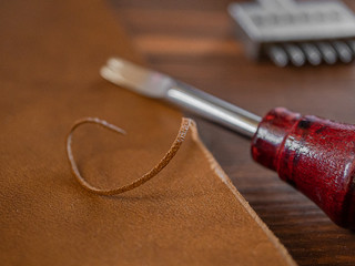 Genuine Leather. Sewing a purse. Leather work. Tools for sewing bags, wallets, clutches. Stitching....