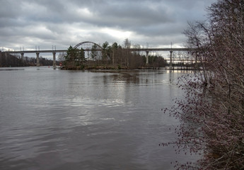 View of the bridges across the Saimaa Canal on a cloudy spring day.