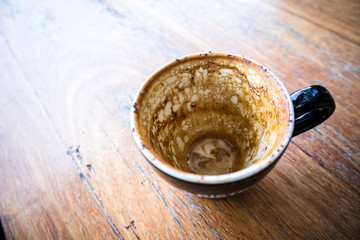 Empty coffee cup on the wood table