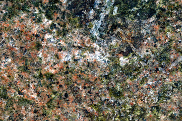 Blurred and unfocused marble wall background with mixed colors. More brown tint