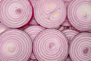 Onion slices as a background. Top view.