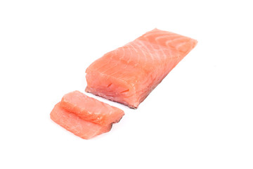 Sliced salmon fillet isolated on white background.